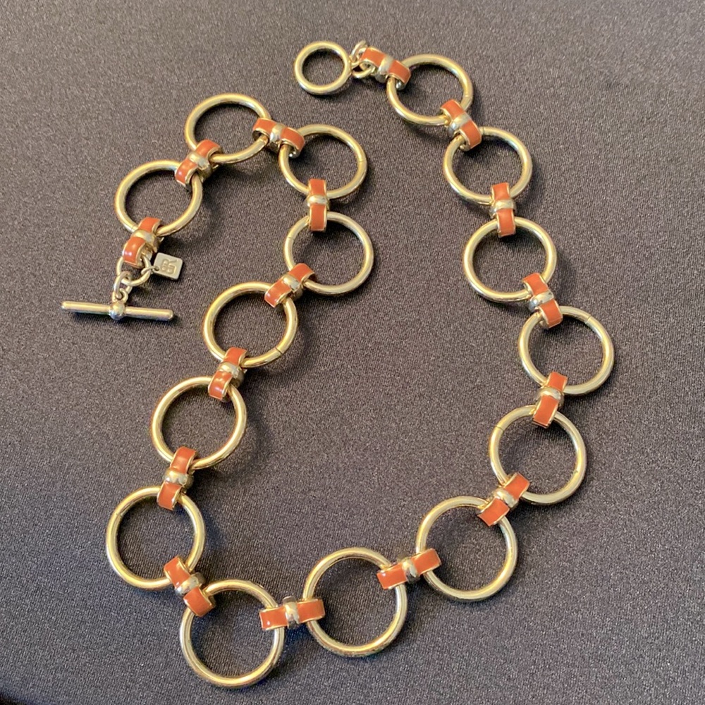 Banana Republic gold tone circle link necklace with dark coral color grommets